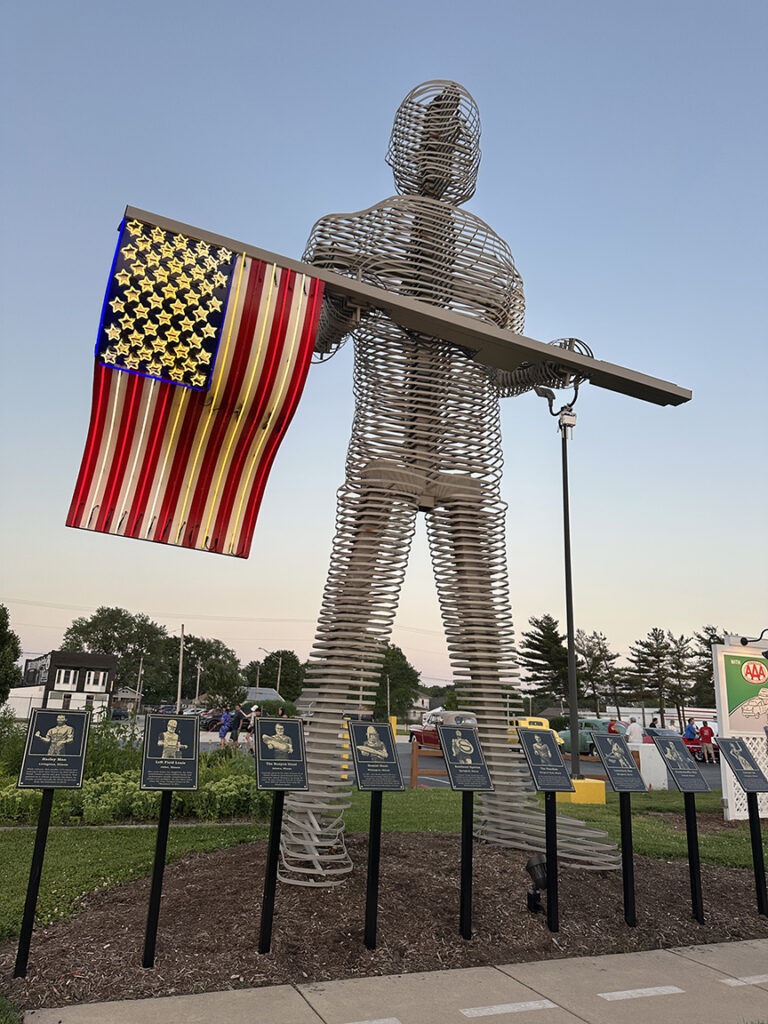 wire statue of a soldeir holding a U.S. Flag made from wire