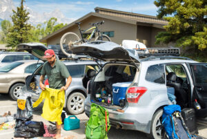 Packing and organizing road trip gear into vehicle