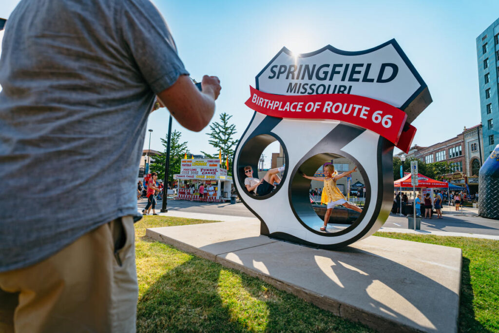 Aman taking a photo of the Springfield Rte 66 statue
