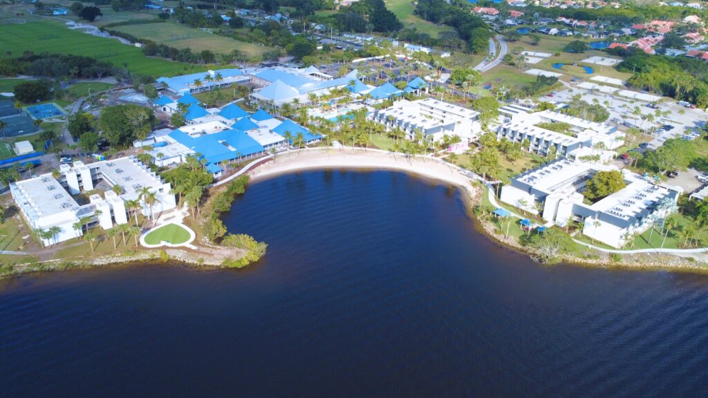 aerial view of city next to waterfront in a u shape