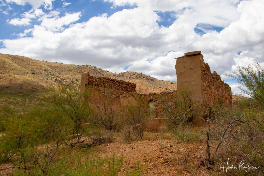 ruins of a stone building in the desert hills of Arizona
