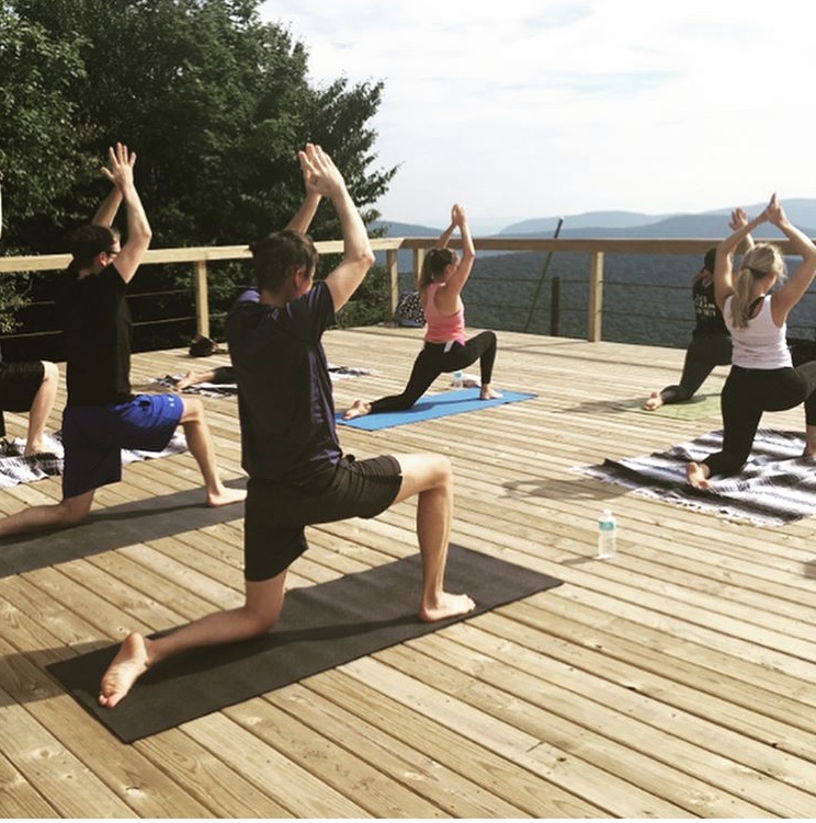 A group of people practicing yoga.
