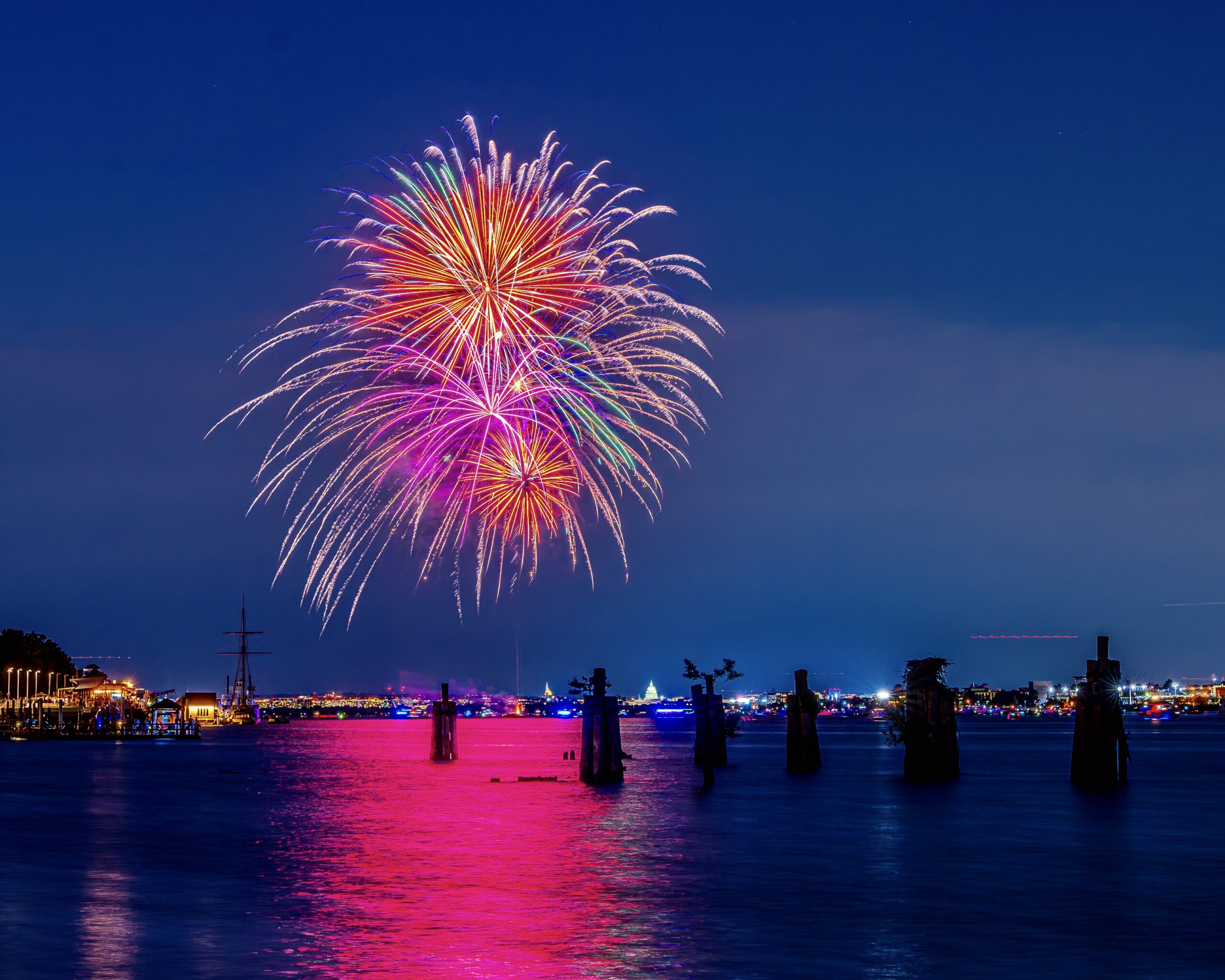 Fireworks over the water. 