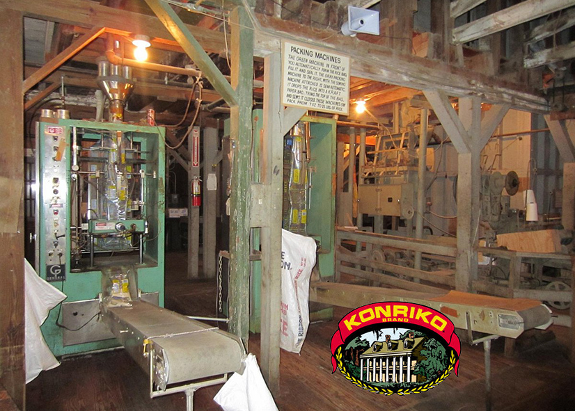 inside a rice mill with vintage posts and machines