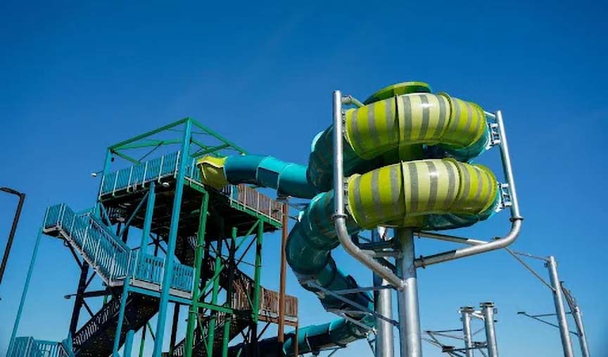 green and turquise curved loop water tube ride 