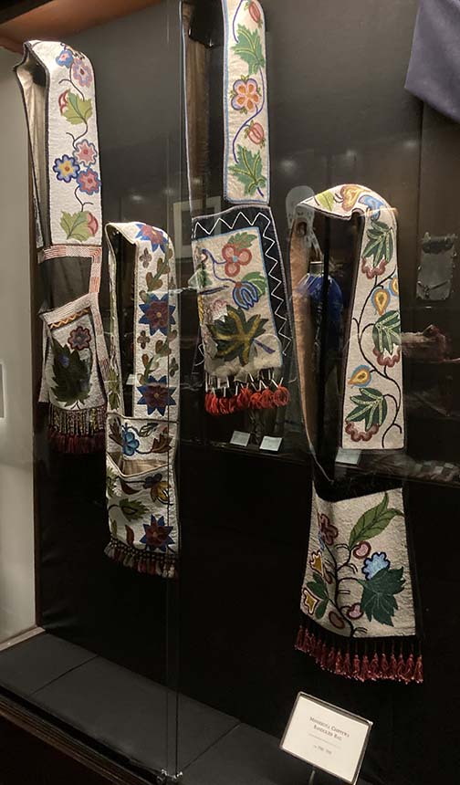 strands of intriquit beadwork displayed on hangers