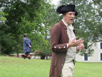 Man in 1770's costume reacting the declaration of independence
