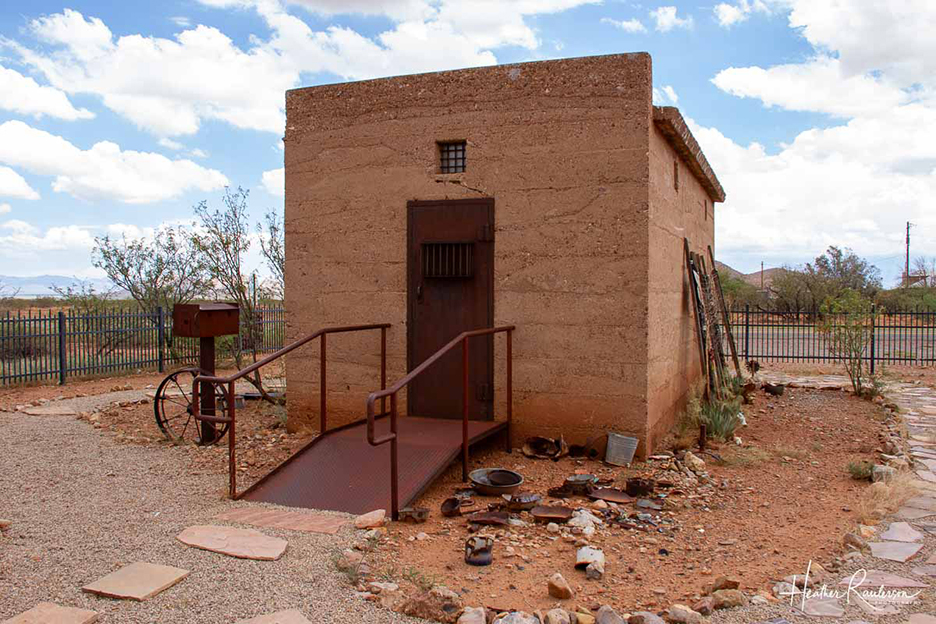 small square single story building with on door and no windows used as a jail