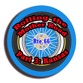 a round sky blue thidck border around a black and white tire announcin g Rte 66