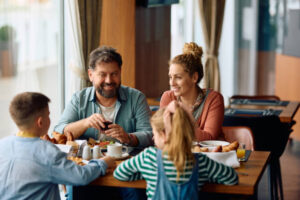 Family enjoying hotel breakfast