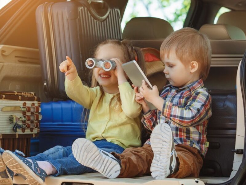 Kids playing in the back of an open vehicle