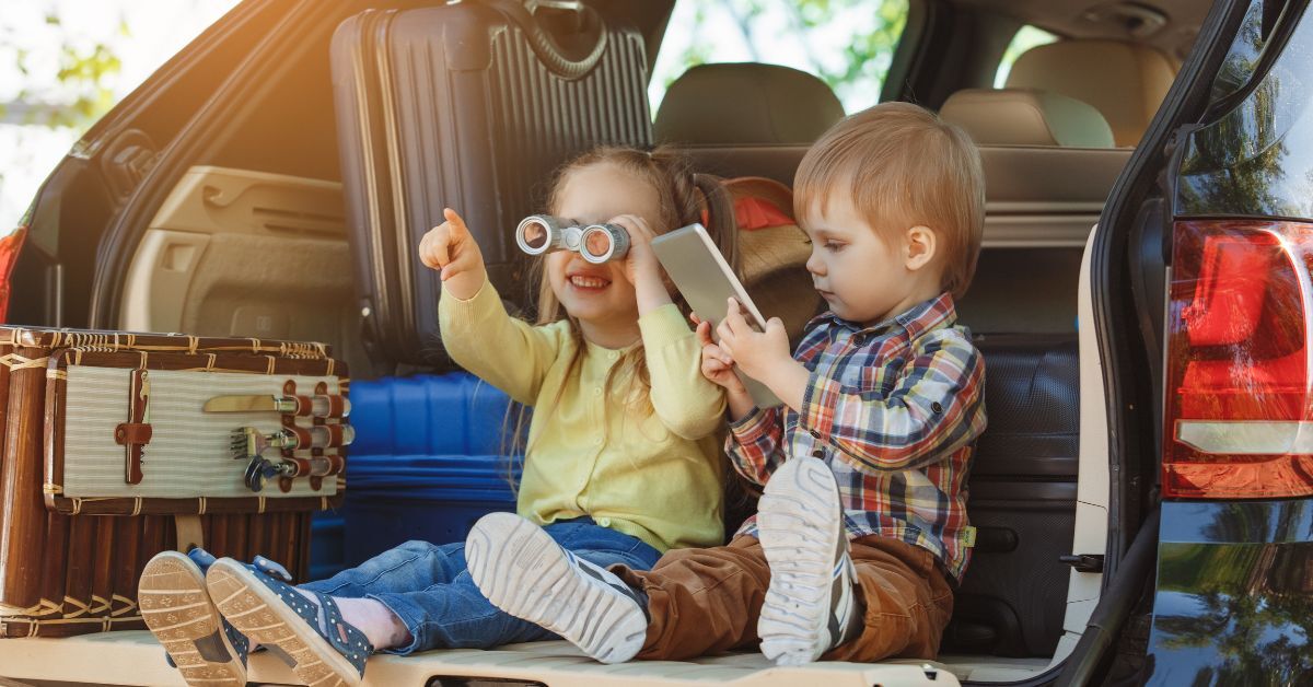 Kids playing in the back of an open vehicle