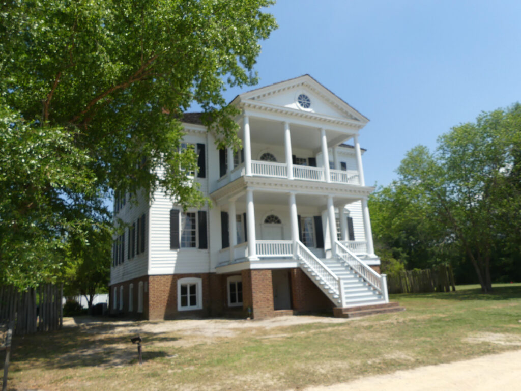two story colonial style square house 