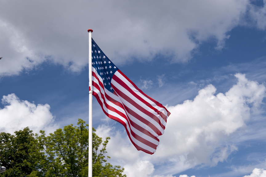 Flag in front of blue sky