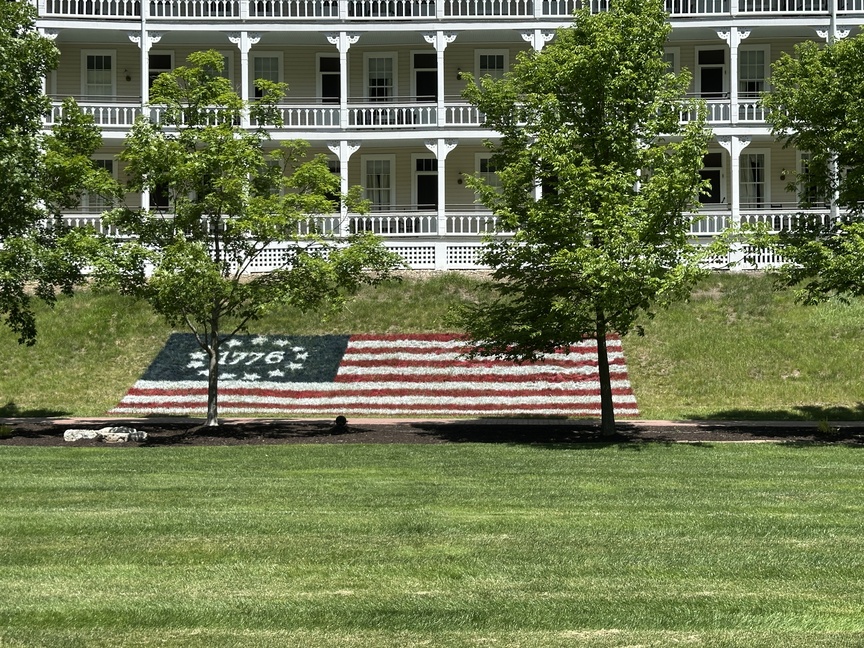 Large 1776 Flag on the grass.