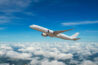 a single airplane flying in the sky