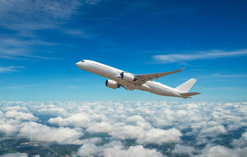 a single airplane flying in the sky